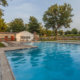 Shimmering swimming pool and deck at Mill Grove apartments in Audubon